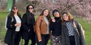 A group of students standing in a park